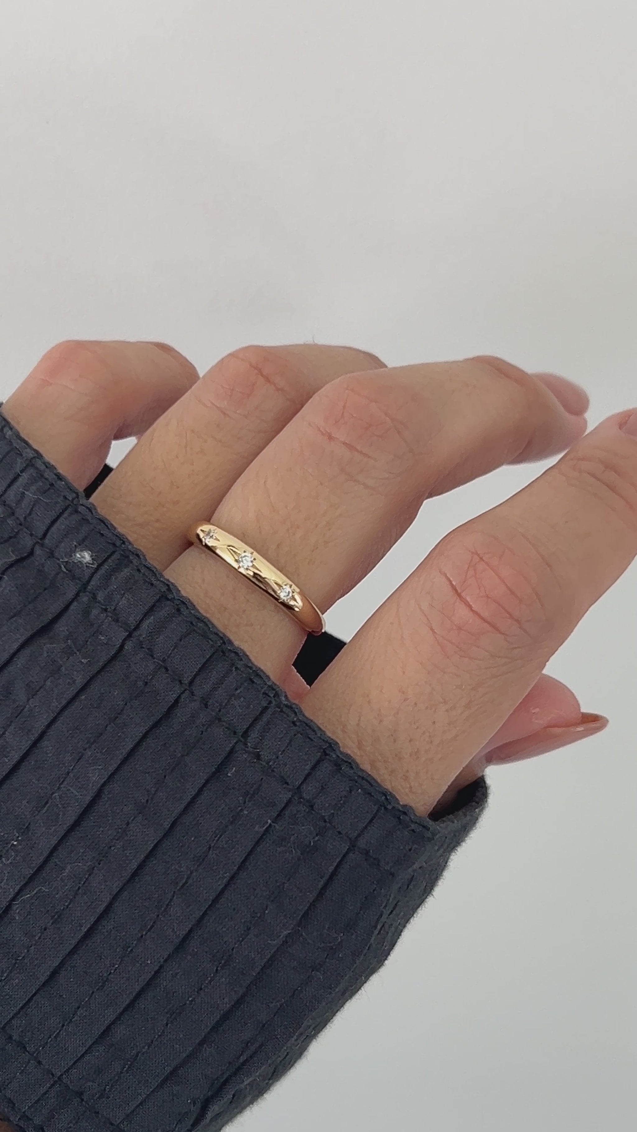 Video of model wearing thin starburst ring in gold from Sami Jewels