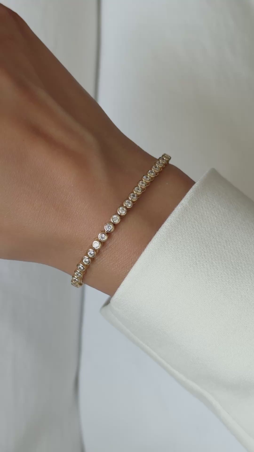 Video of the moissanite round bezel tennis bracelet in gold vermeil