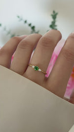 emerald cushion ring in gold on model