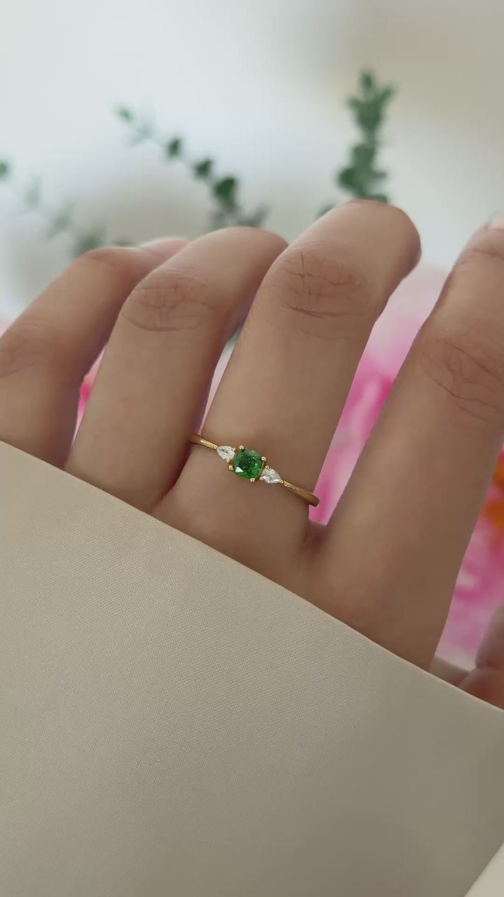 emerald cushion ring in gold on model