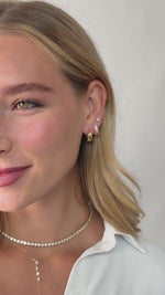 baguette huggie earrings in models second hole piercing in gold 