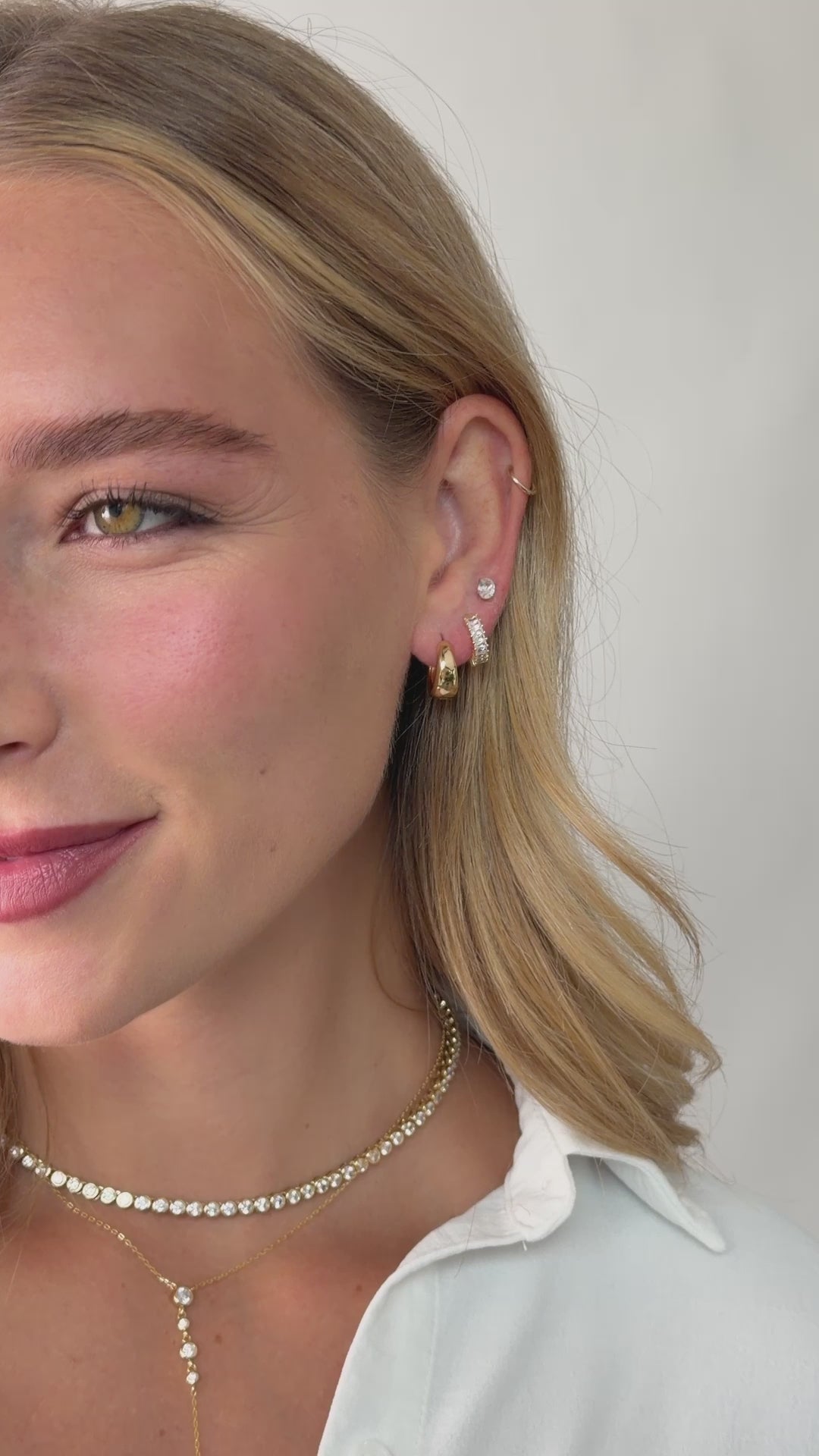 baguette huggie earrings in models second hole piercing in gold 