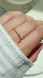 Video of model showcasing delicate gold eternity ring with pave diamonds 
