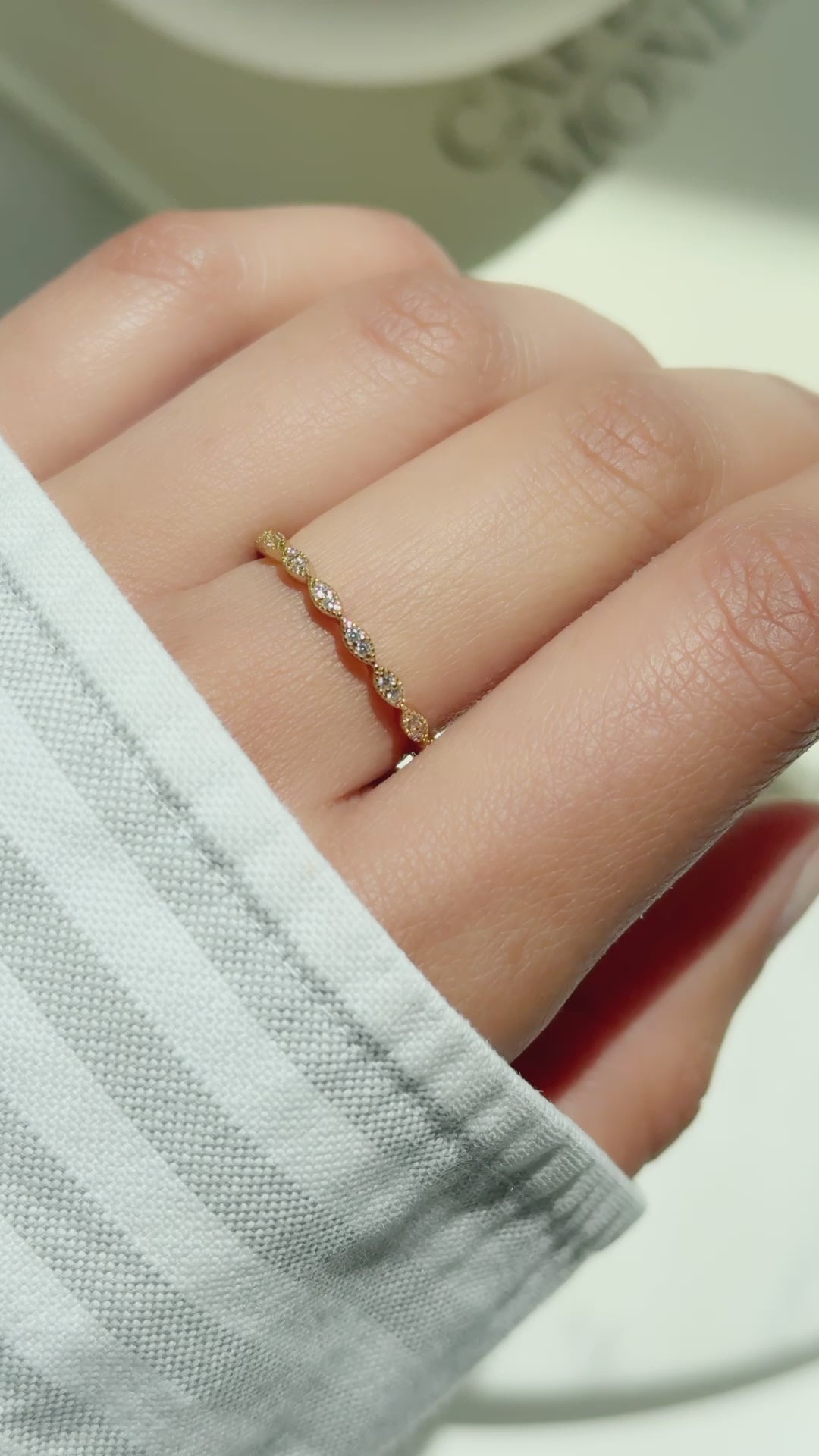 Video of model showcasing delicate gold eternity ring with pave diamonds 