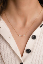 Video of model wearing gradient bezel necklace