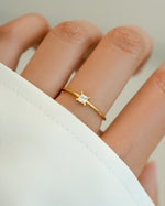 Gold princess cut dainty ring by Sami Jewels, close-up of the elegant ring showcasing its sparkling princess-cut gemstone.