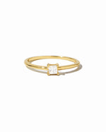 Gold princess cut dainty ring from Sami Jewels, featuring a sleek design on a white background.