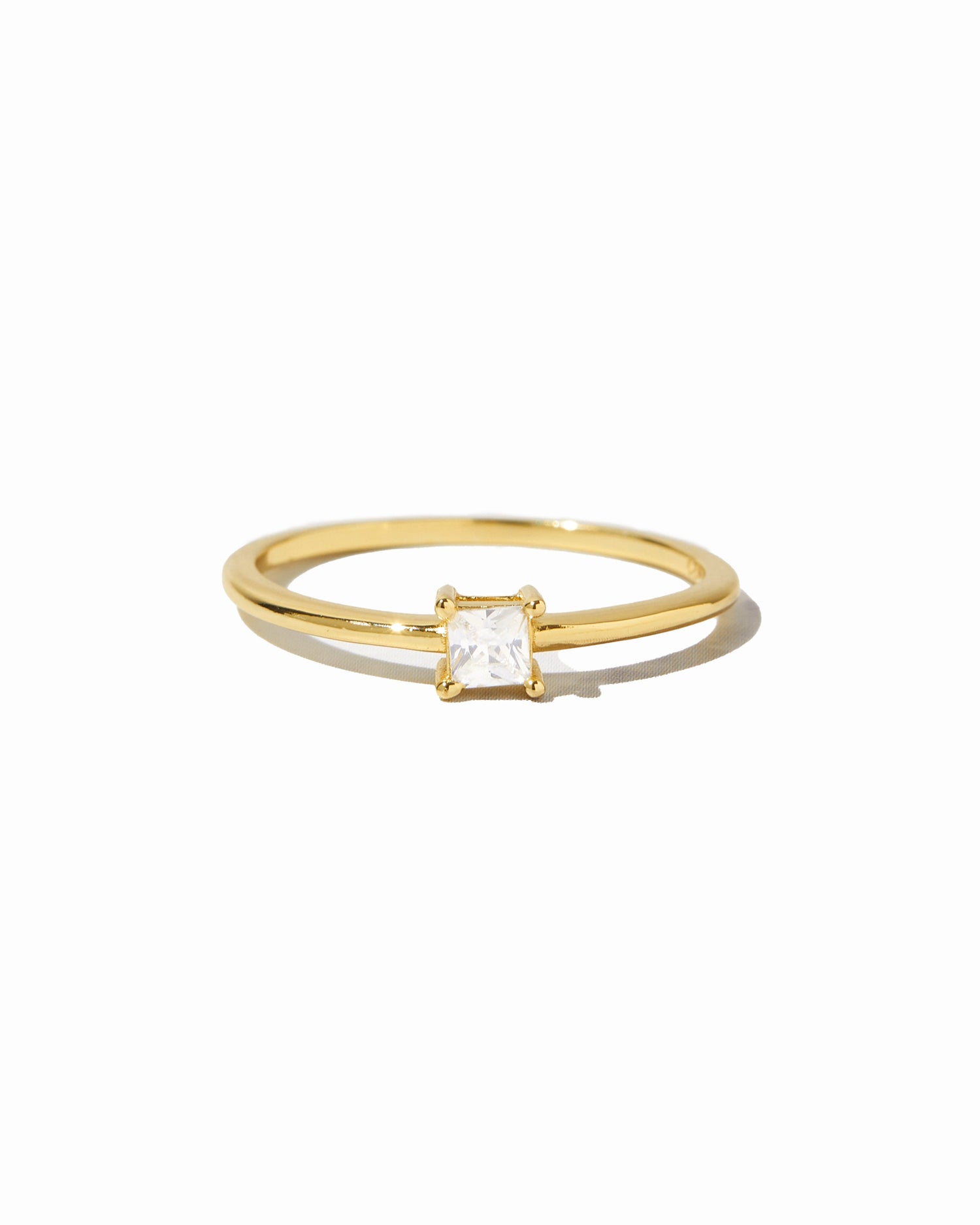Gold princess cut dainty ring from Sami Jewels, featuring a sleek design on a white background.