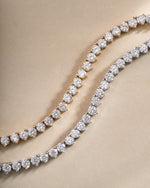 Sami Jewels Stella Tennis Necklace with prong-set diamonds in gold and silver, elegant jewelry piece with sparkling gemstones.