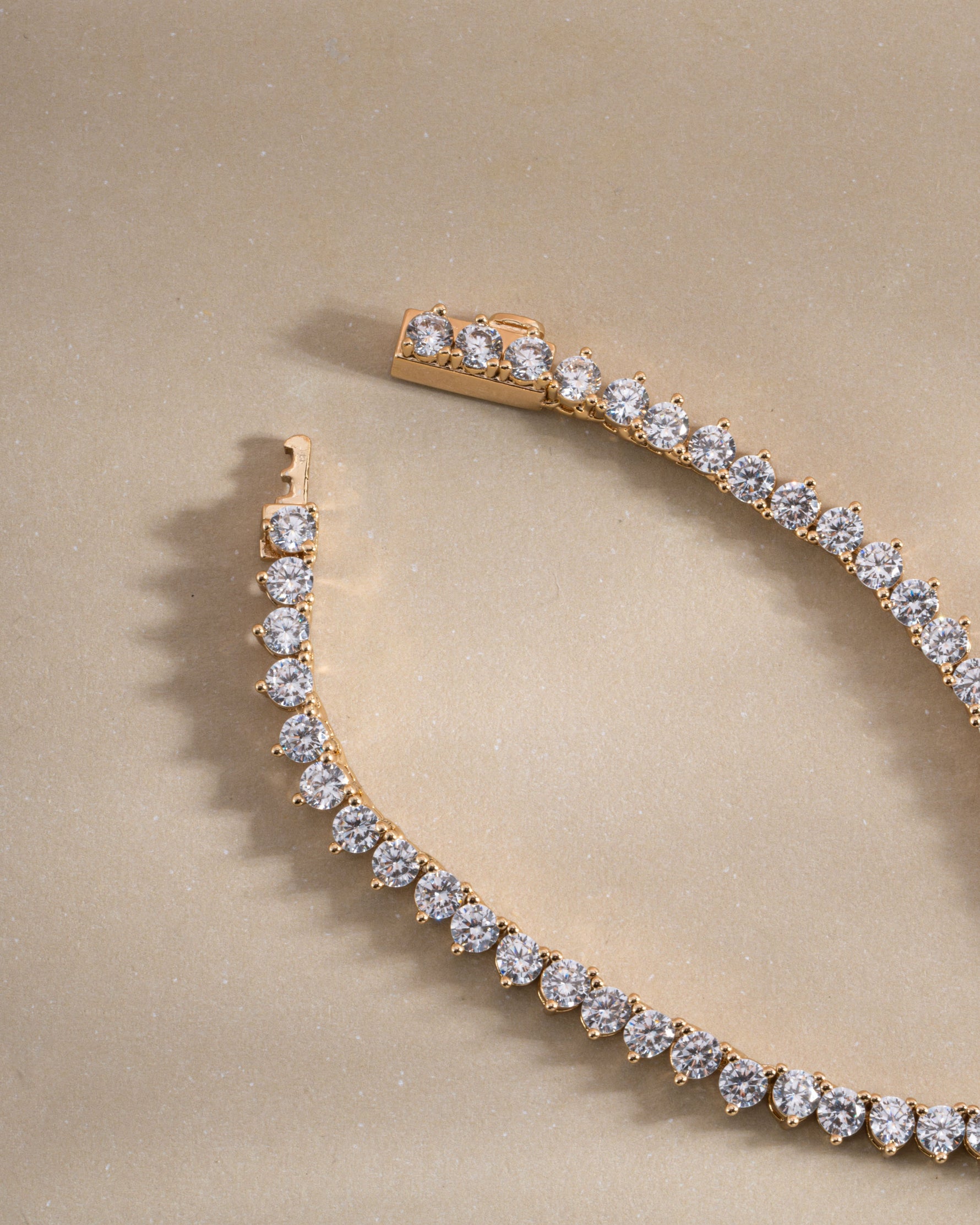 Sami Jewels Stella tennis necklace with prong-set diamonds in gold, featuring box clasp closure.