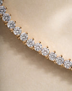 Close-up of Sami Jewels Stella Tennis Necklace featuring sparkling prong-set diamond tennis chain in gold.