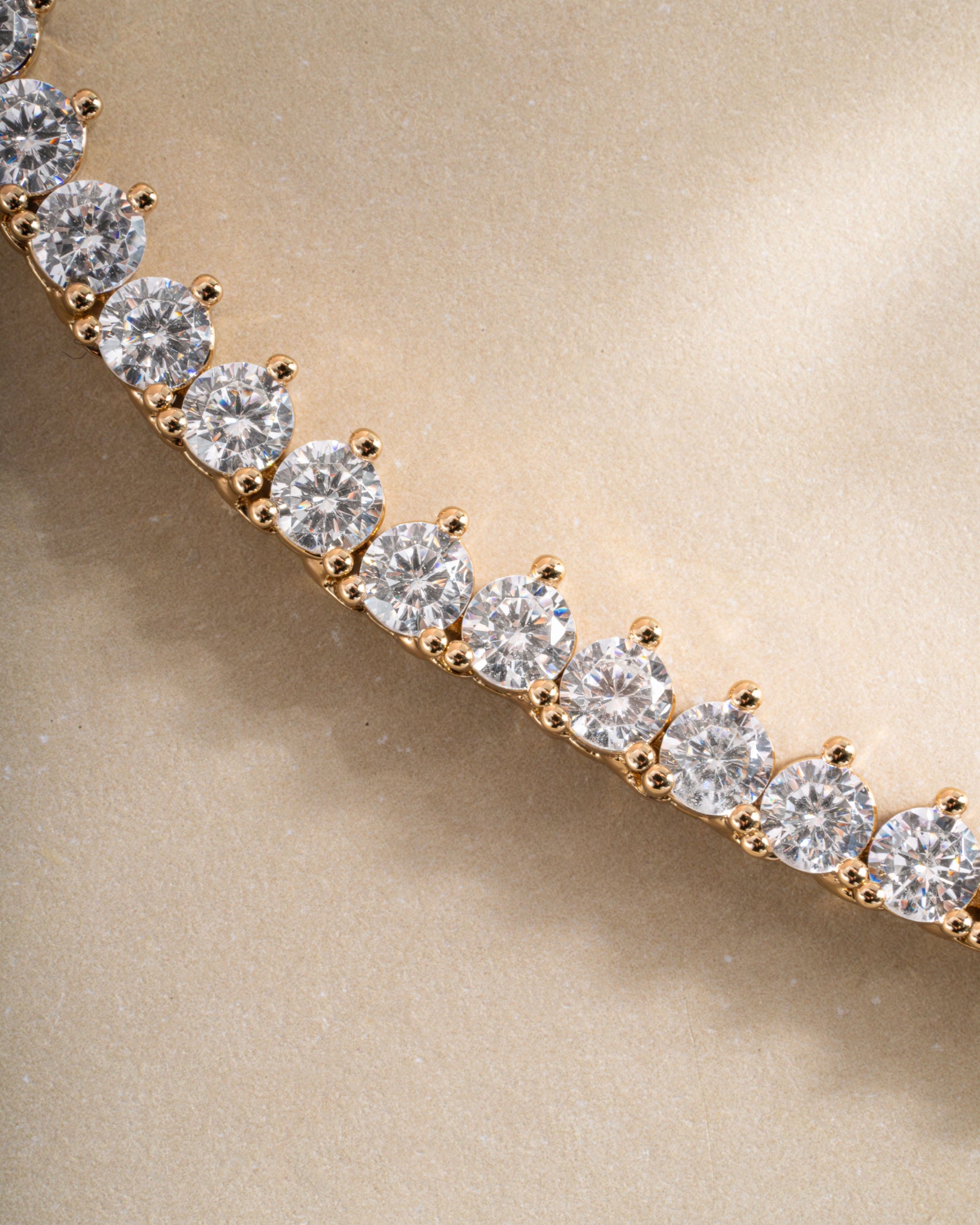Close-up of Sami Jewels Stella Tennis Necklace featuring sparkling prong-set diamond tennis chain in gold.