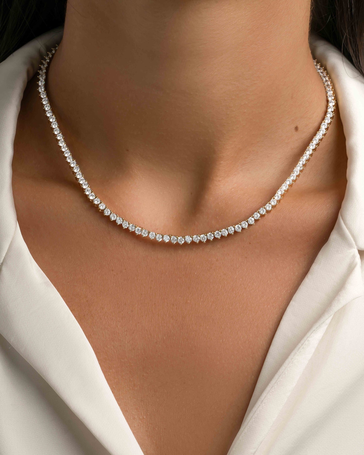 Gold Stella Tennis Necklace with prong-set diamonds from Sami Jewels, featuring a sleek, elegant design on a model.