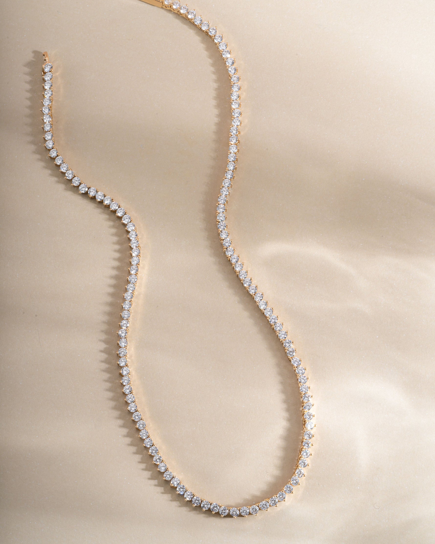 Gold Stella Tennis Necklace by Sami Jewels featuring a prong-set diamond tennis chain for elegant style.