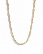 Sami Jewels Stella tennis necklace with prong-set diamonds in gold, displayed on a white background.