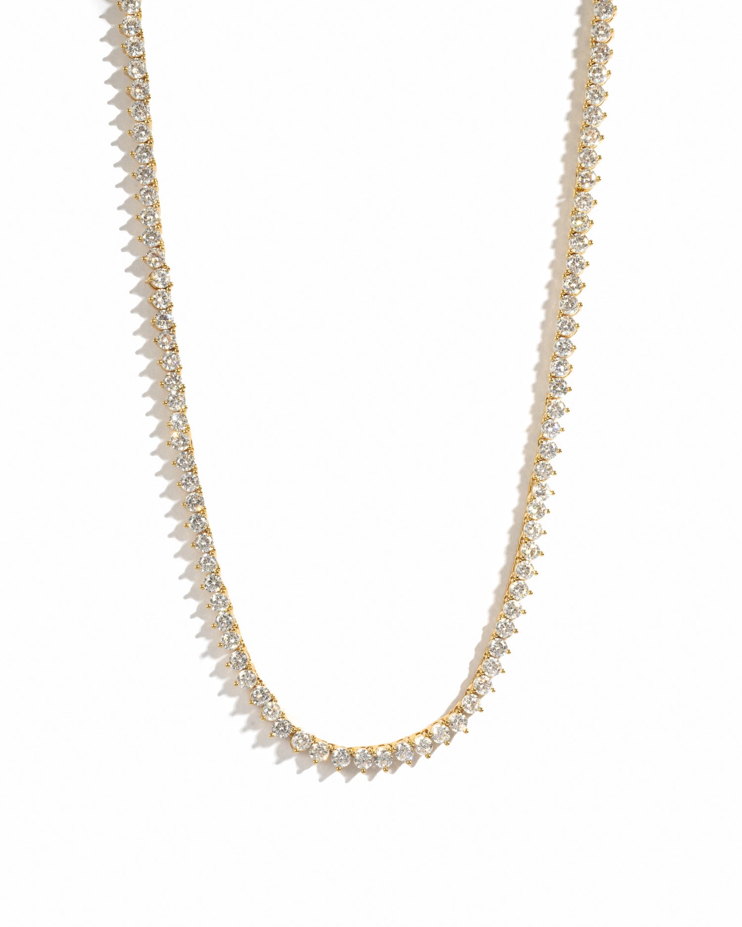 Sami Jewels Stella tennis necklace with prong-set diamonds in gold, displayed on a white background.