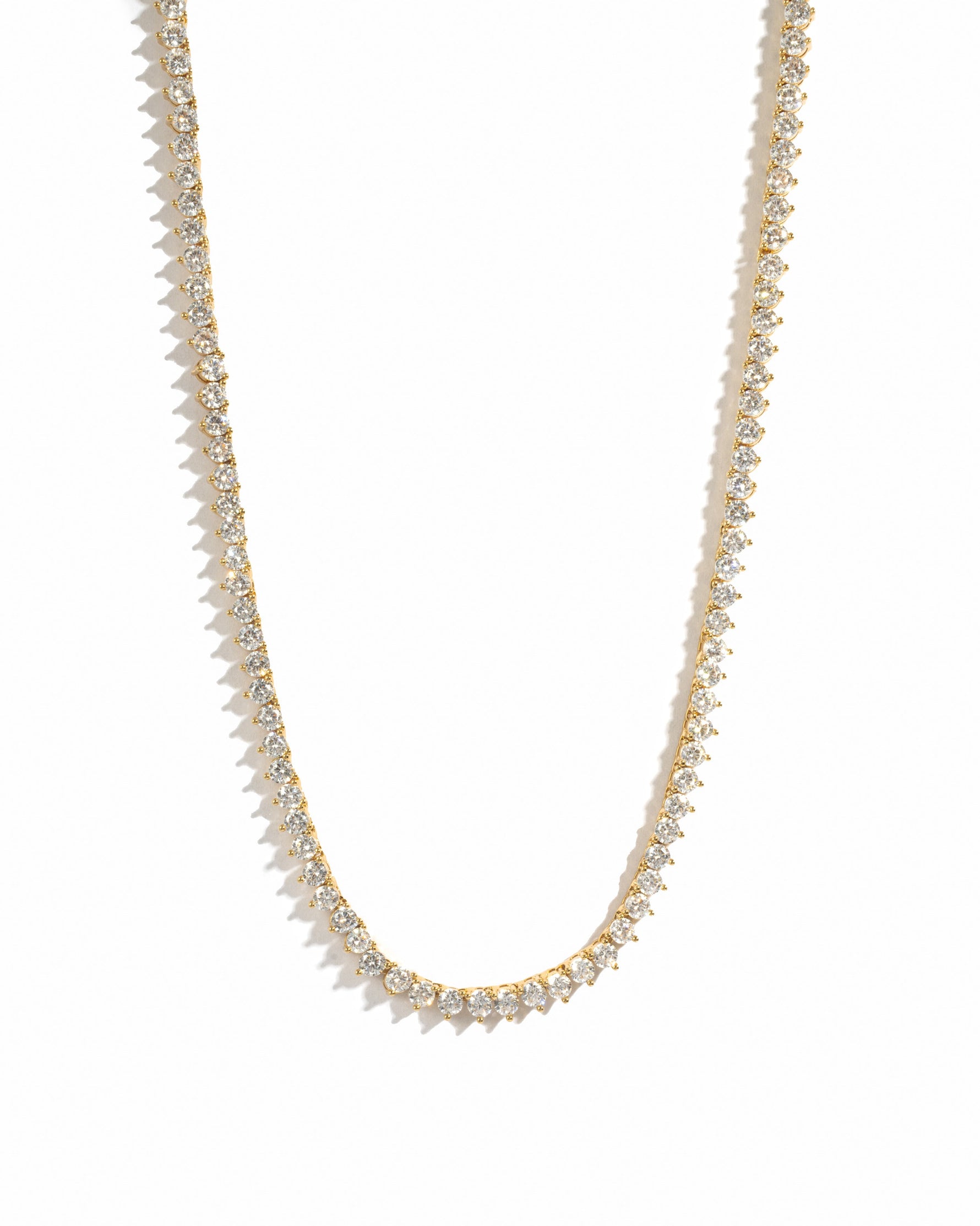 Sami Jewels Stella tennis necklace with prong-set diamonds in gold, displayed on a white background.