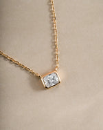 Close-up of Sami Jewels Radiant Bezel Necklace in gold, showcasing its elegant design and sparkling bezel setting.