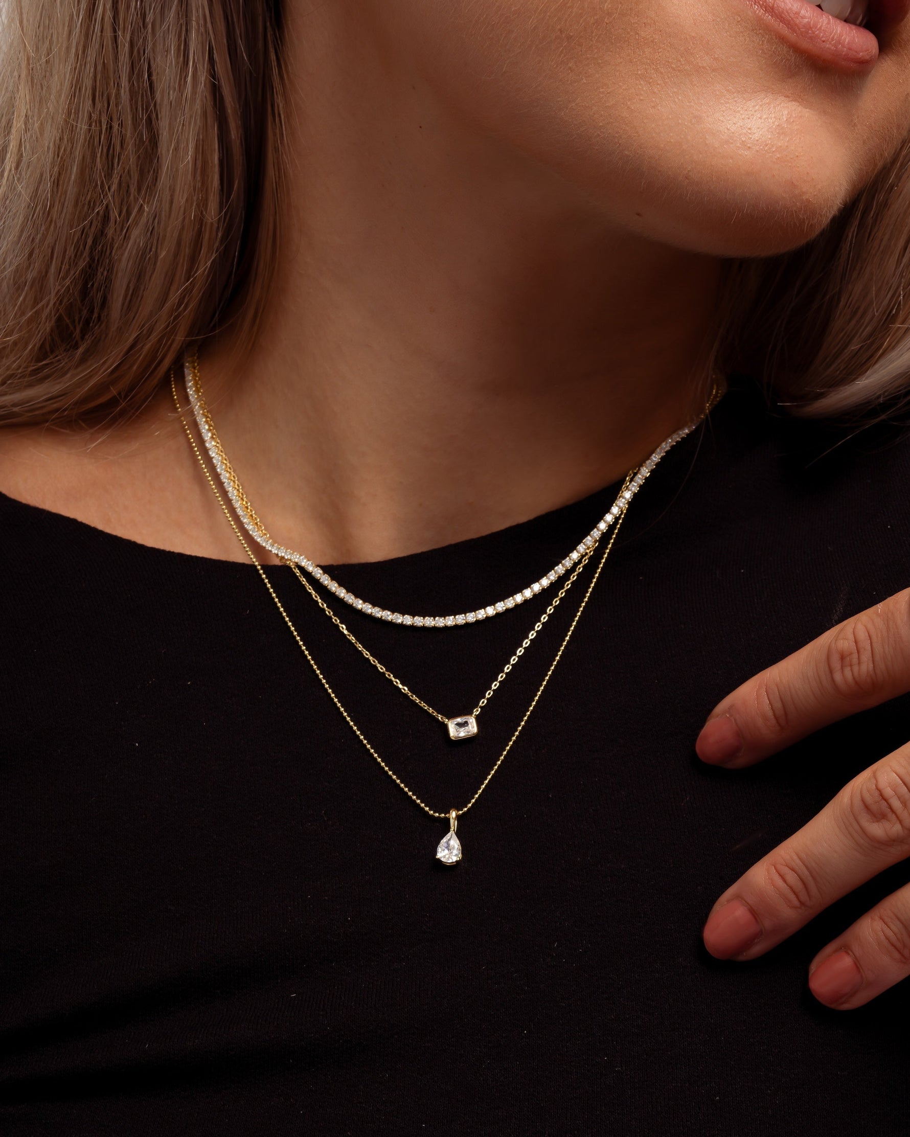 Gold Radiant Bezel Necklace by Sami Jewels featuring a sleek, polished design on a model.