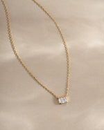 Golden Radiant Bezel Necklace by Sami Jewels featuring a sleek, elegant design with a radiant bezel pendant on a delicate chain.