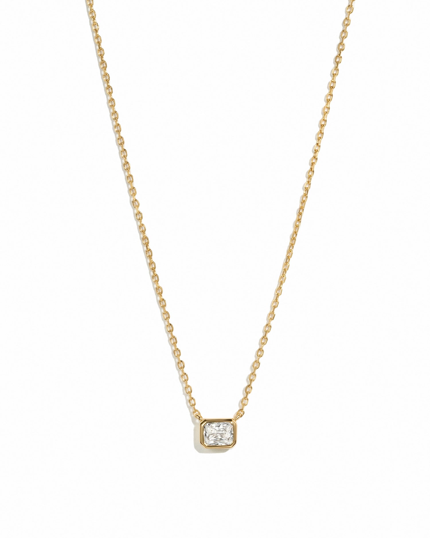Gold Radiant Bezel Necklace from Sami Jewels displayed on a white background.