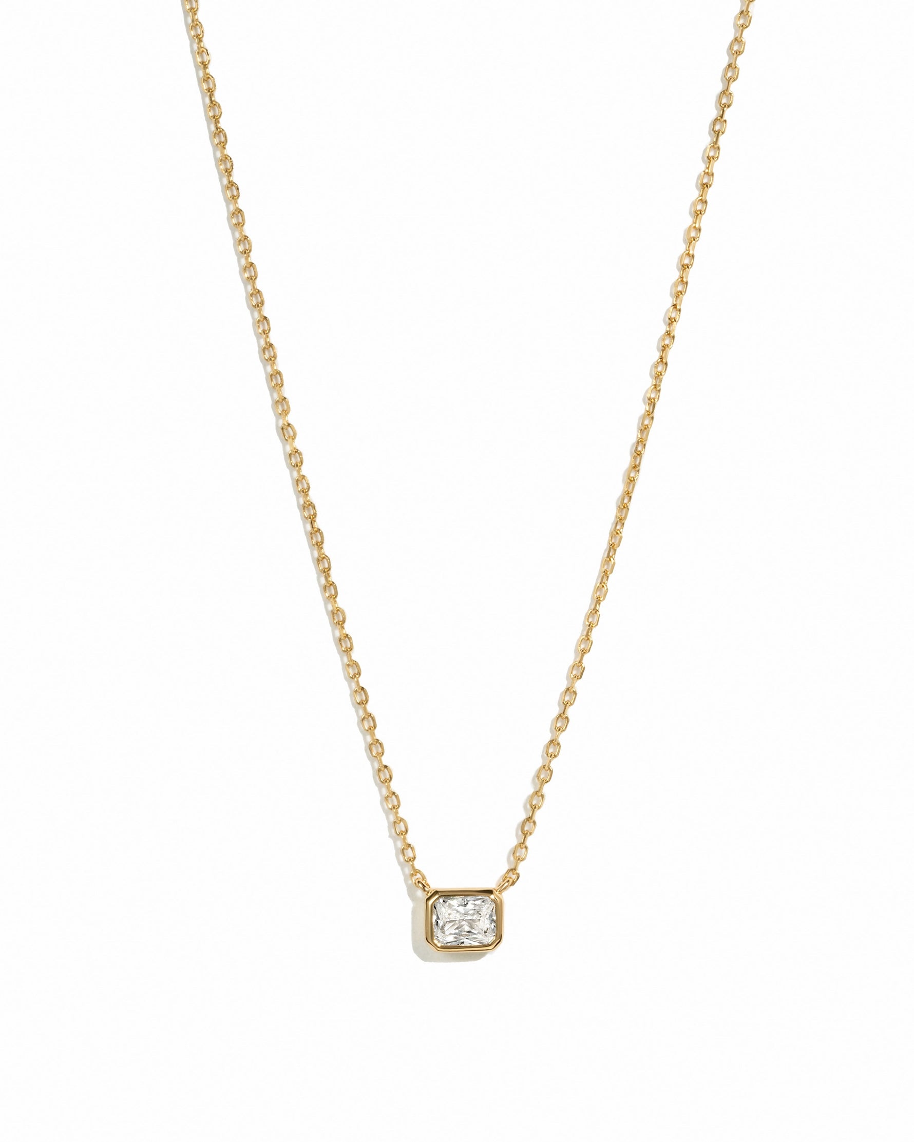 Gold Radiant Bezel Necklace by Sami Jewels displayed on a white background, showcasing its elegant design and sparkling details.