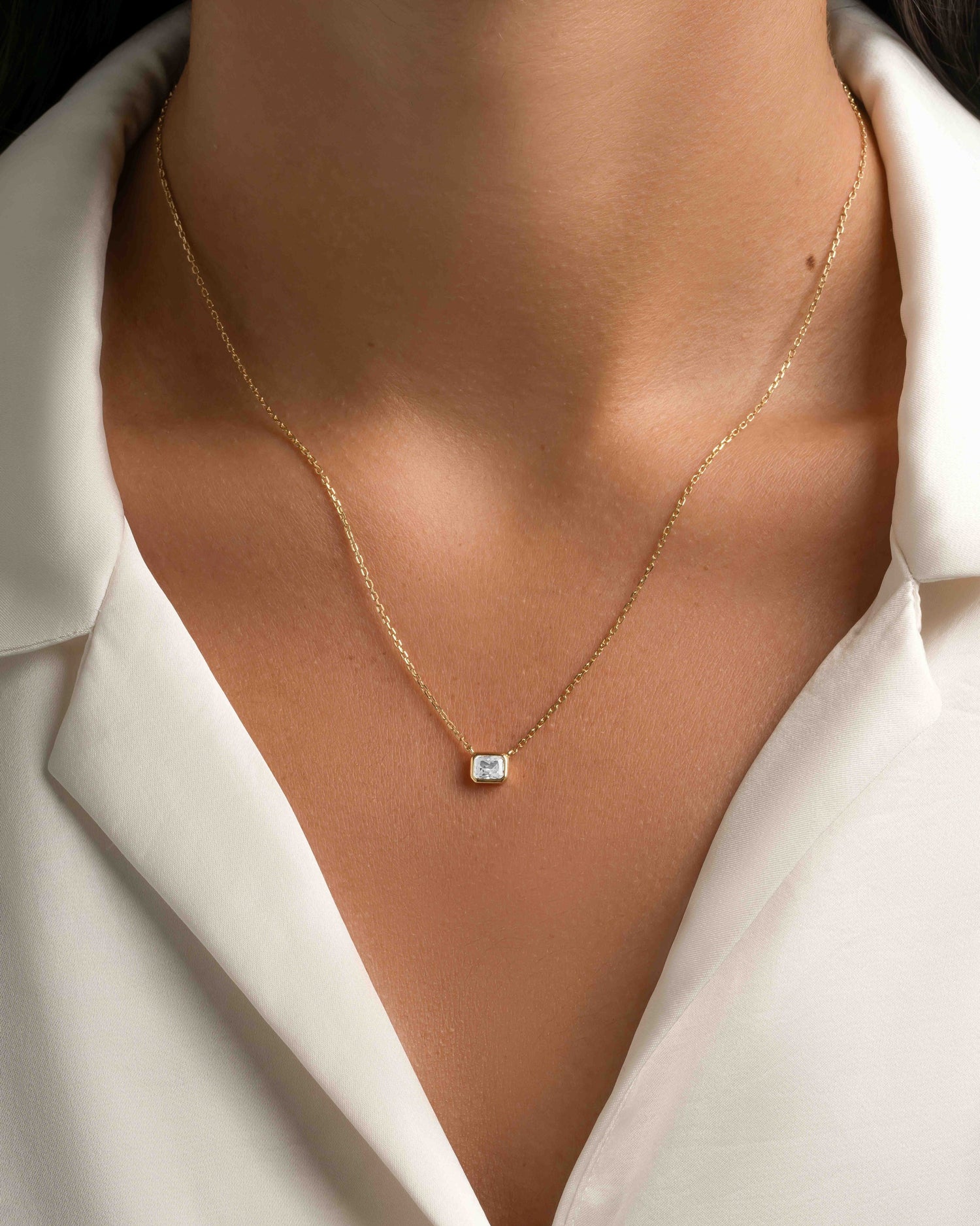 Gold Radiant Bezel Necklace by Sami Jewels, close-up of the elegant pendant with a radiant bezel design.