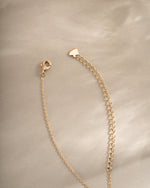 Gold Radiant Bezel Necklace with lobster clasp closure by Sami Jewels, featuring a sleek and elegant design.