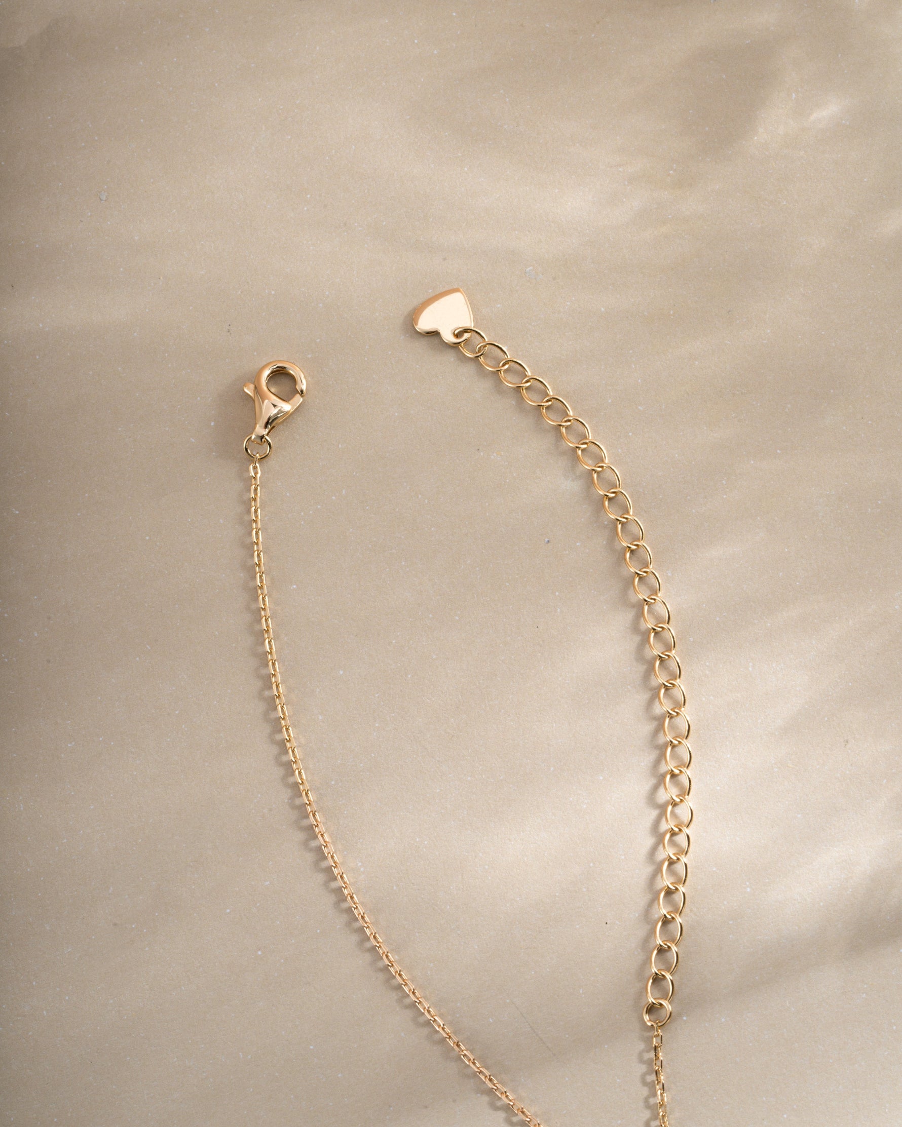 Gold Radiant Bezel Necklace with lobster clasp closure by Sami Jewels, featuring a sleek and elegant design.