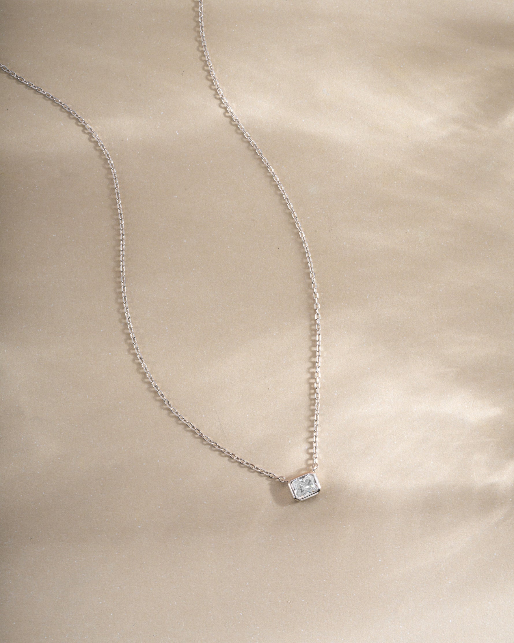 Sterling silver Radiant Bezel Necklace from Sami Jewels featuring a sleek, modern design with a radiant bezel setting.