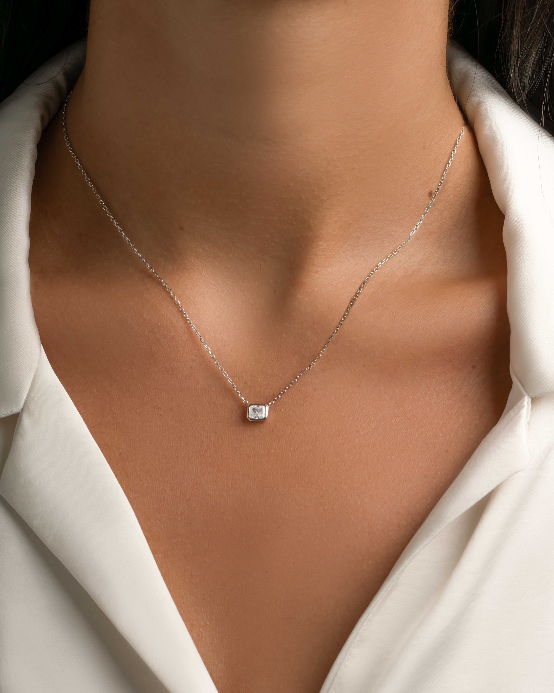 Sterling silver Radiant Bezel Necklace by Sami Jewels, featuring a shiny, modern design with a central radiant bezel pendant.