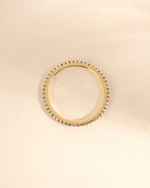 Gold Rainbow Eternity Ring by Sami Jewels, top view showing colorful rainbow design and continuous band in detailed close-up.