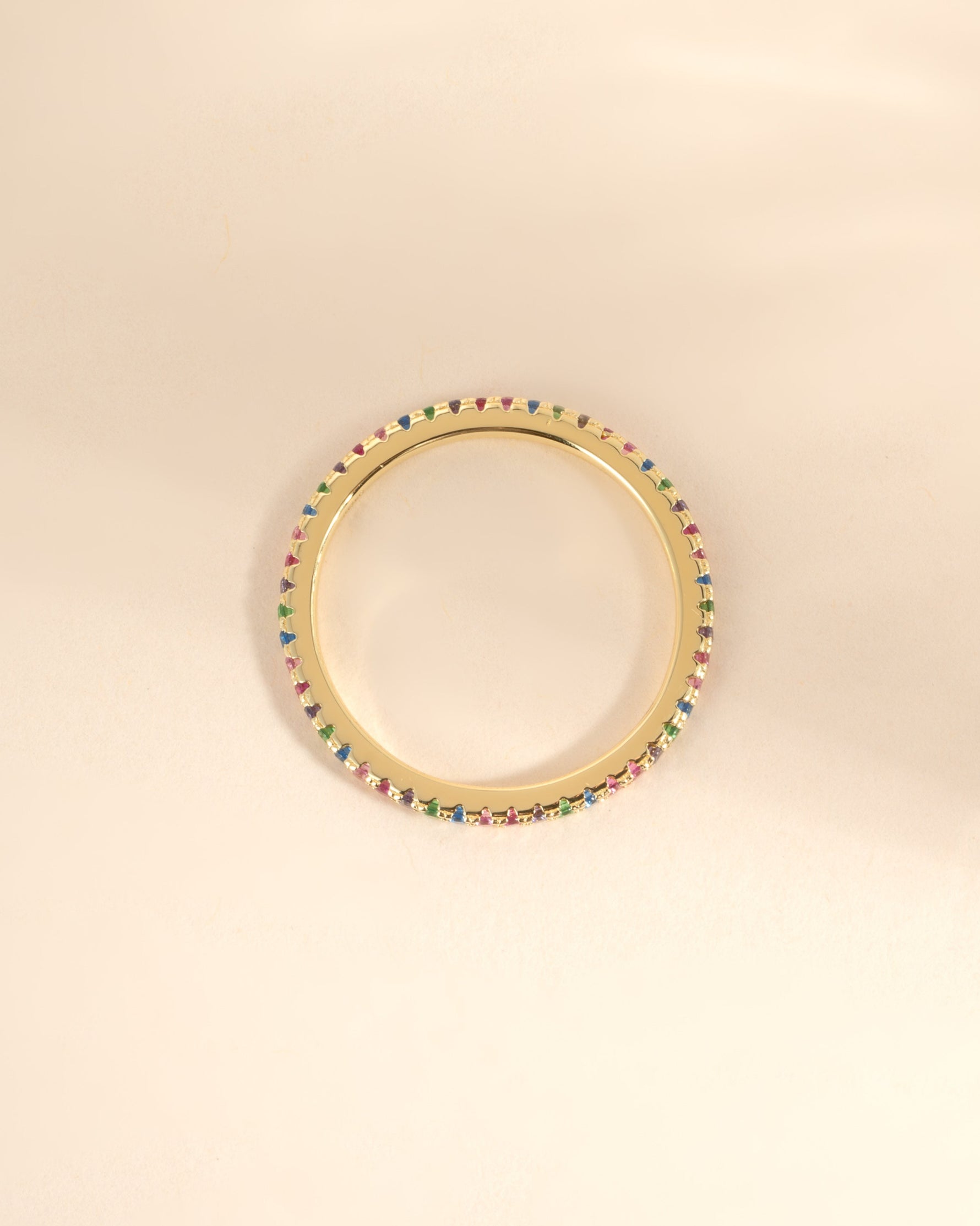 Gold Rainbow Eternity Ring by Sami Jewels, top view showing colorful rainbow design and continuous band in detailed close-up.