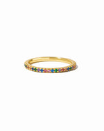 Gold Rainbow Eternity Ring by Sami Jewels featuring a continuous rainbow-colored gemstone design on a white background.