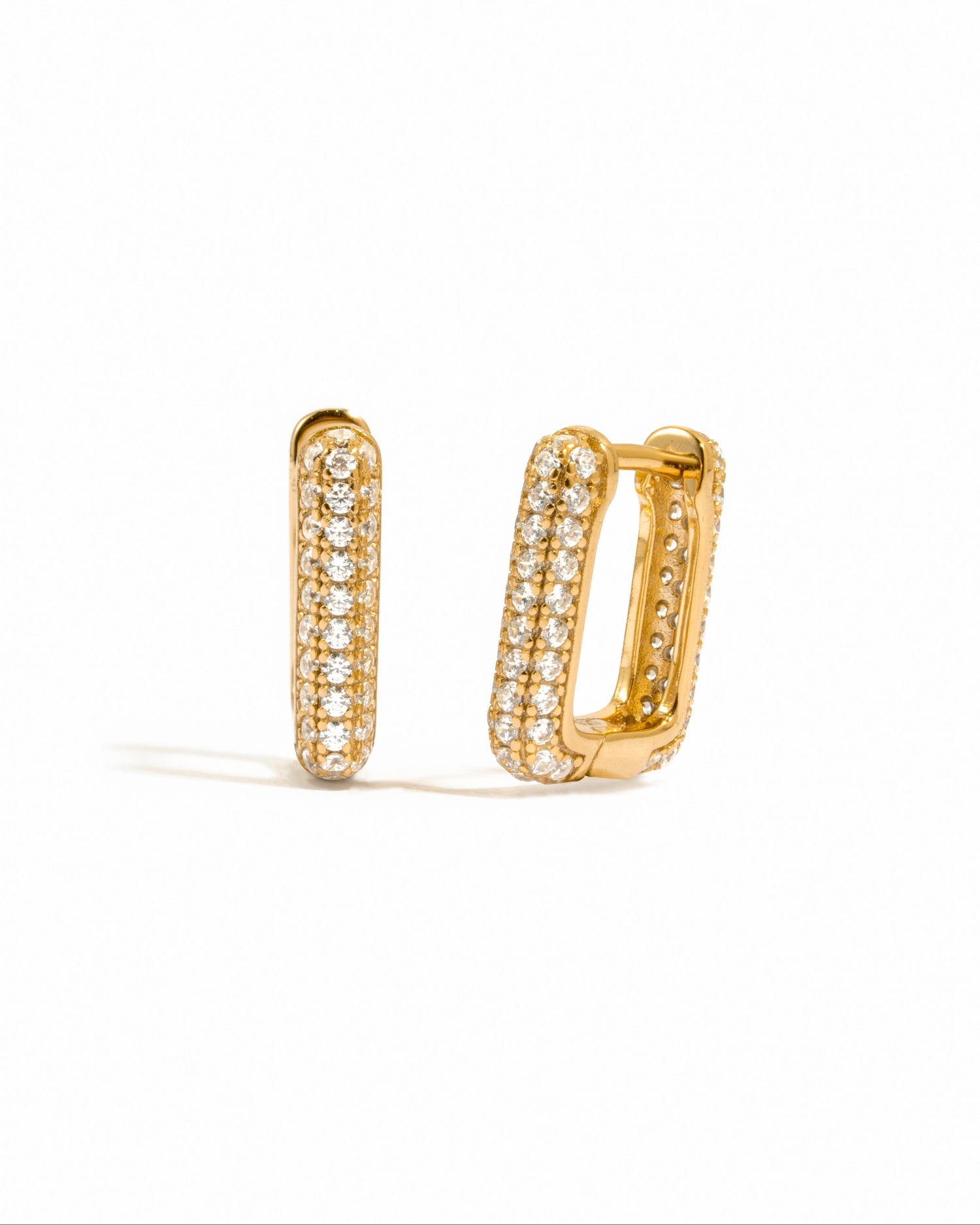 Gold rectangle Huggies earrings by Sami Jewels with a sleek rectangular design on a white background.