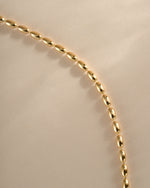 Close-up of Sami Jewels gold rice bead necklace showcasing its delicate texture and intricate bead design.