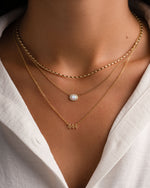 Gold Rice Bead Necklace by Sami Jewels, featuring delicate rice-shaped beads worn by a model.