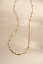 Gold Rice Bead Necklace from Sami Jewels featuring a delicate string of small rice-shaped beads.