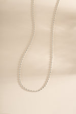 Sterling silver Rice Bead Necklace by Sami Jewels featuring small, polished rice-shaped beads on a delicate chain.