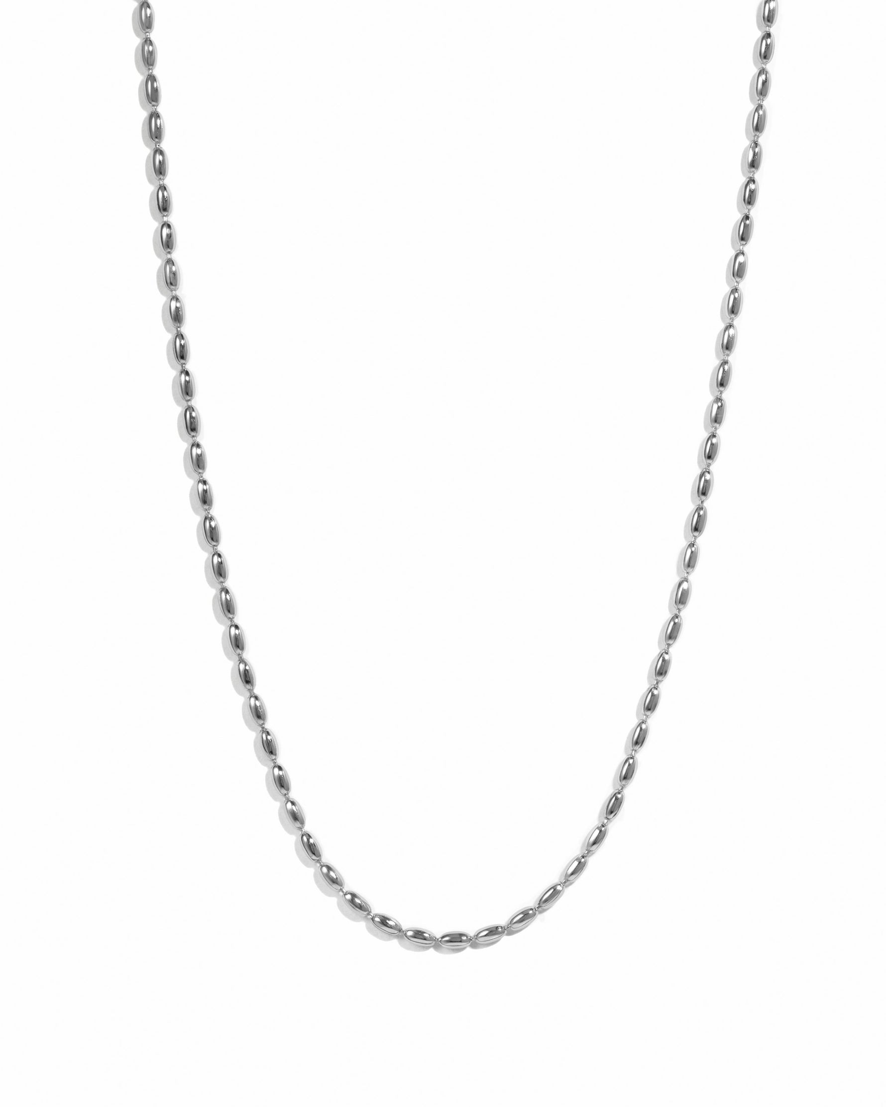 Sterling silver Rice Bead Necklace by Sami Jewels displayed on a white background with detailed rice-shaped beads.