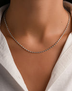 Sterling silver Rice Bead Necklace by Sami Jewels featuring small, polished rice-shaped beads on a delicate chain.
