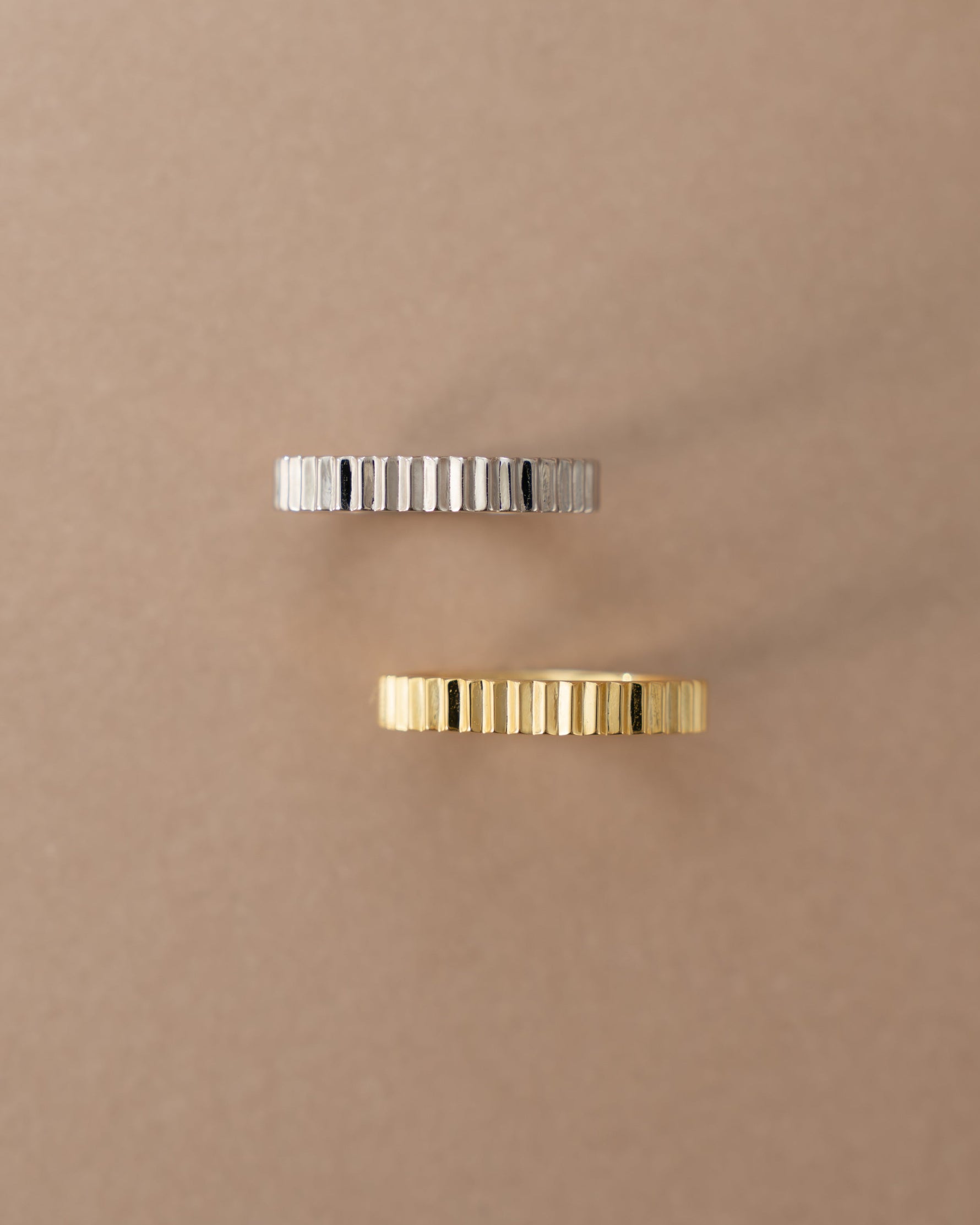 Close-up of Sami Jewels gold and sterling silver ridged ring showcasing textured design and sleek finish.