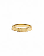 Gold ridged ring by Sami Jewels, showcasing a textured band on a white background.