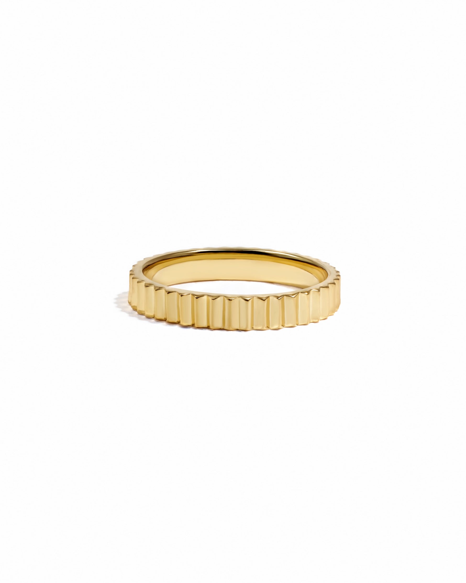 Gold ridged ring by Sami Jewels, showcasing a textured band on a white background.