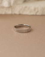 Close-up of Sami Jewels sterling silver ridged ring showing textured, polished band with detailed ridges and smooth finish.