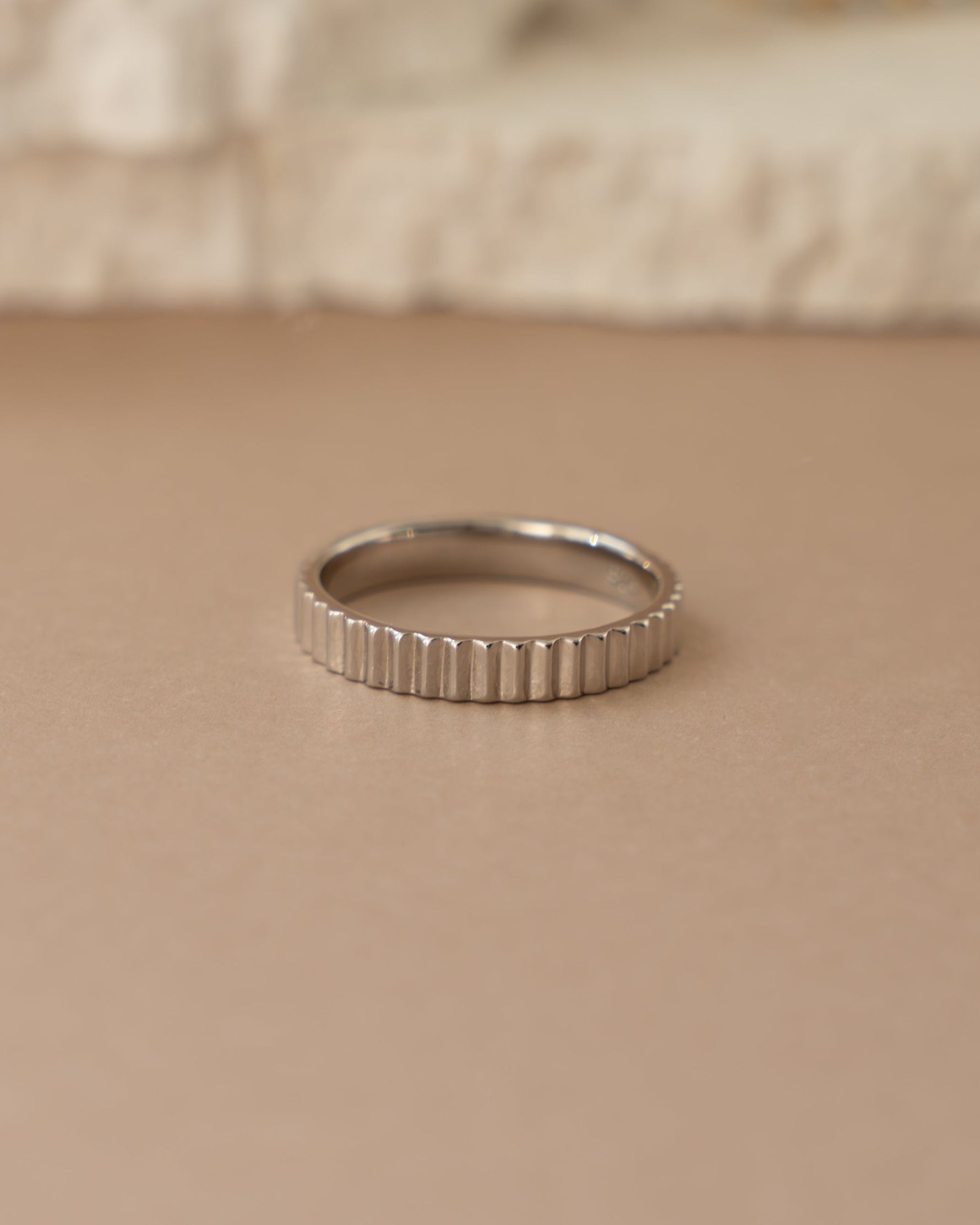 Close-up of Sami Jewels sterling silver ridged ring showing textured, polished band with detailed ridges and smooth finish.