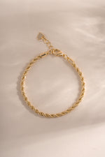 Gold Rope Chain Bracelet by Sami Jewels, showcasing a detailed close-up of the textured, intertwined chain design on a flat lay.