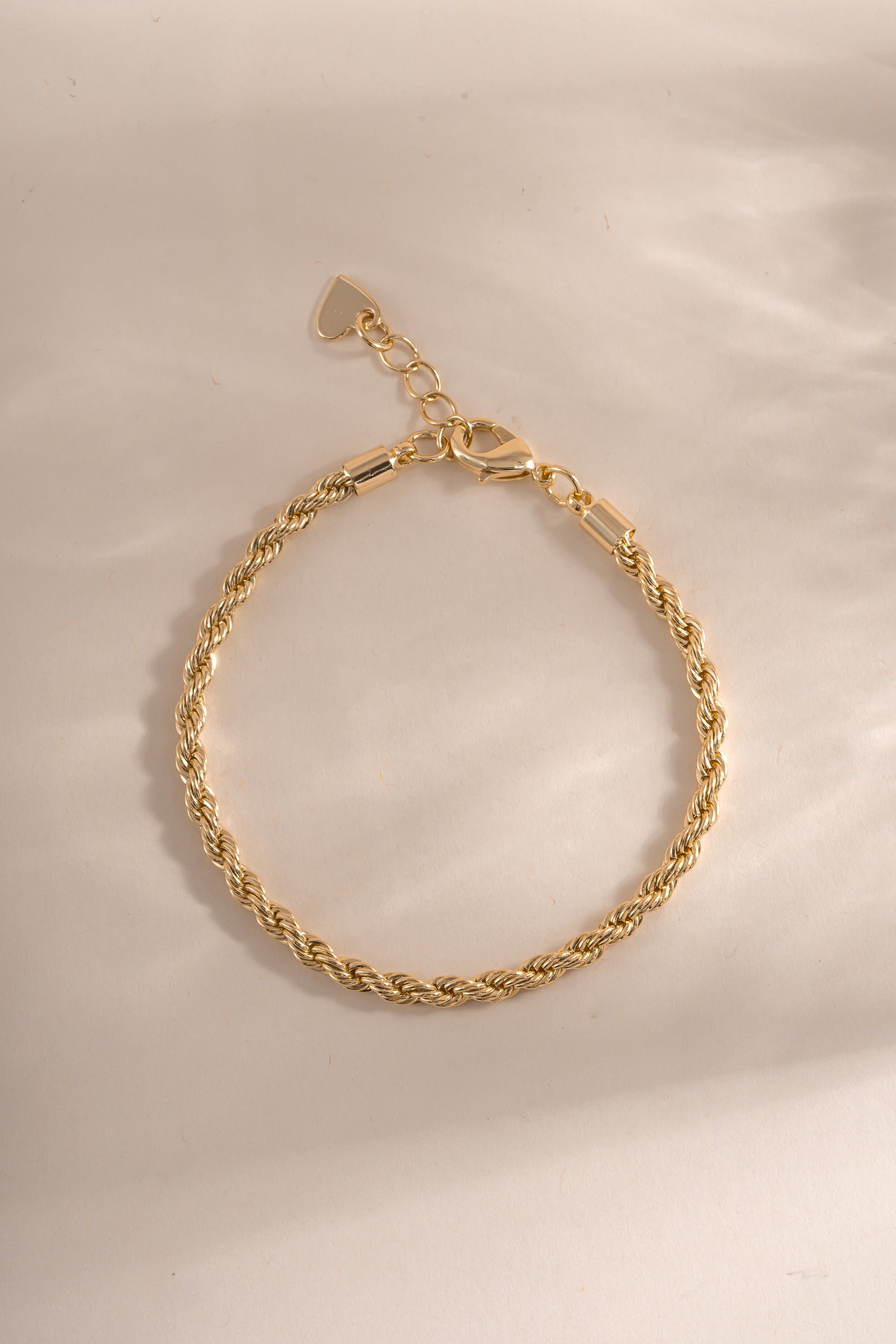 Gold Rope Chain Bracelet by Sami Jewels, showcasing a detailed close-up of the textured, intertwined chain design on a flat lay.
