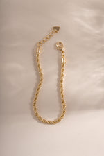 Gold rope chain bracelet by Sami Jewels with lobster clasp closure, featuring a textured braided design.