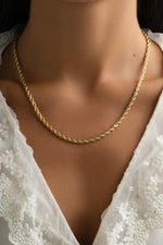 Gold Rope Chain Necklace from Sami Jewels, featuring a detailed twisted rope design on a model.